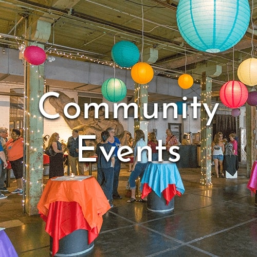 A photo in the event space if an event, decorated with colorful hanging lights. Bar tables decorated. Text overtop says Community Events.