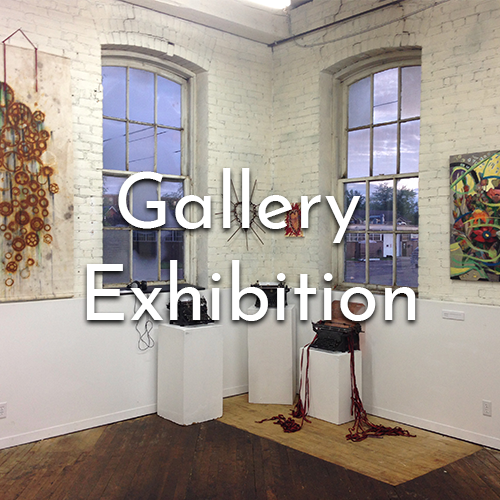 Shot of the gallery space with some art exhibits on display.
