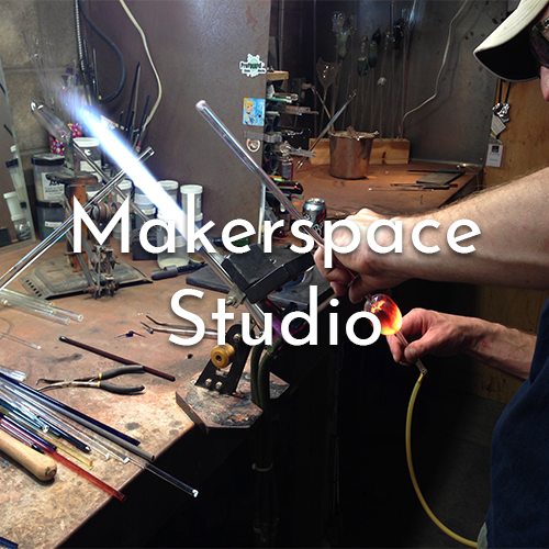 Shot of an artist in the makerspace studio with a blowtorch.