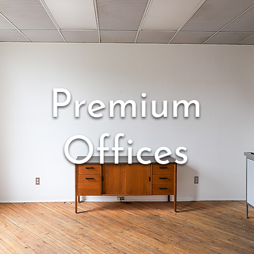 A shot looking into an empty, wide Office space. Tex overtop says "Premium Offices".
